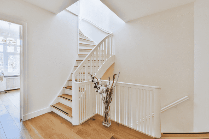 Elegant staircase design in a custom-built home by builders in Ringwood, showcasing high-quality finishes and architectural detail.